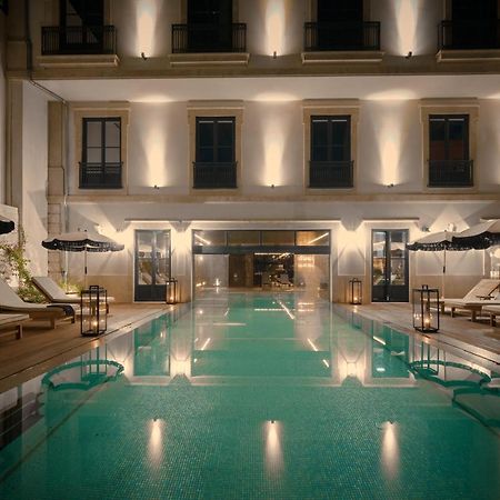 Ga Palace Hotel & Spa, A Xixth-Century Villa Porto Exterior photo The pool at the hotel